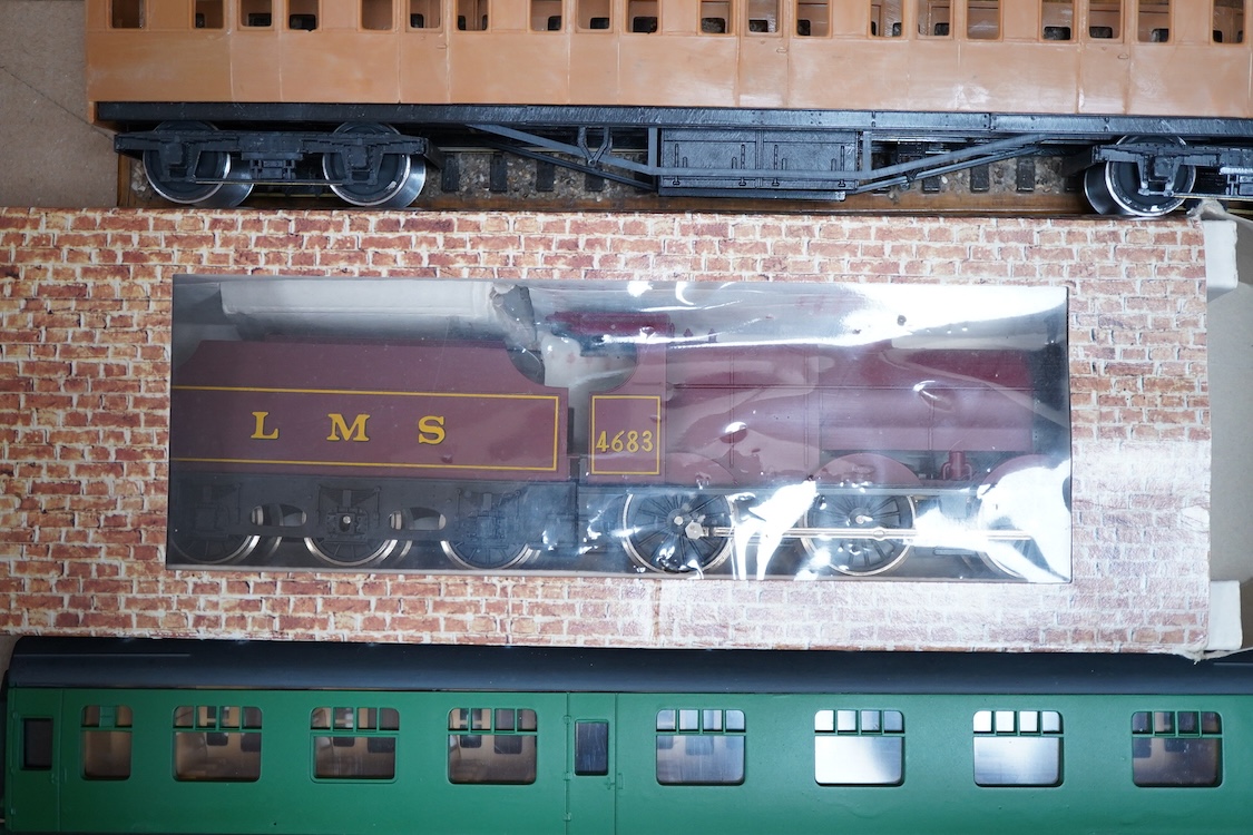 Eleven 0 gauge model railway items including; a bogie stake wagon, two mineral wagons, a North British coal wagon and two further open wagons, a partly constructed brake van, together with a Lima LMS 4F locomotive, two L